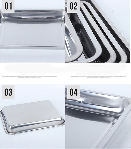 Collection of stainless steel kitchen items including trays and a lid on a white background.