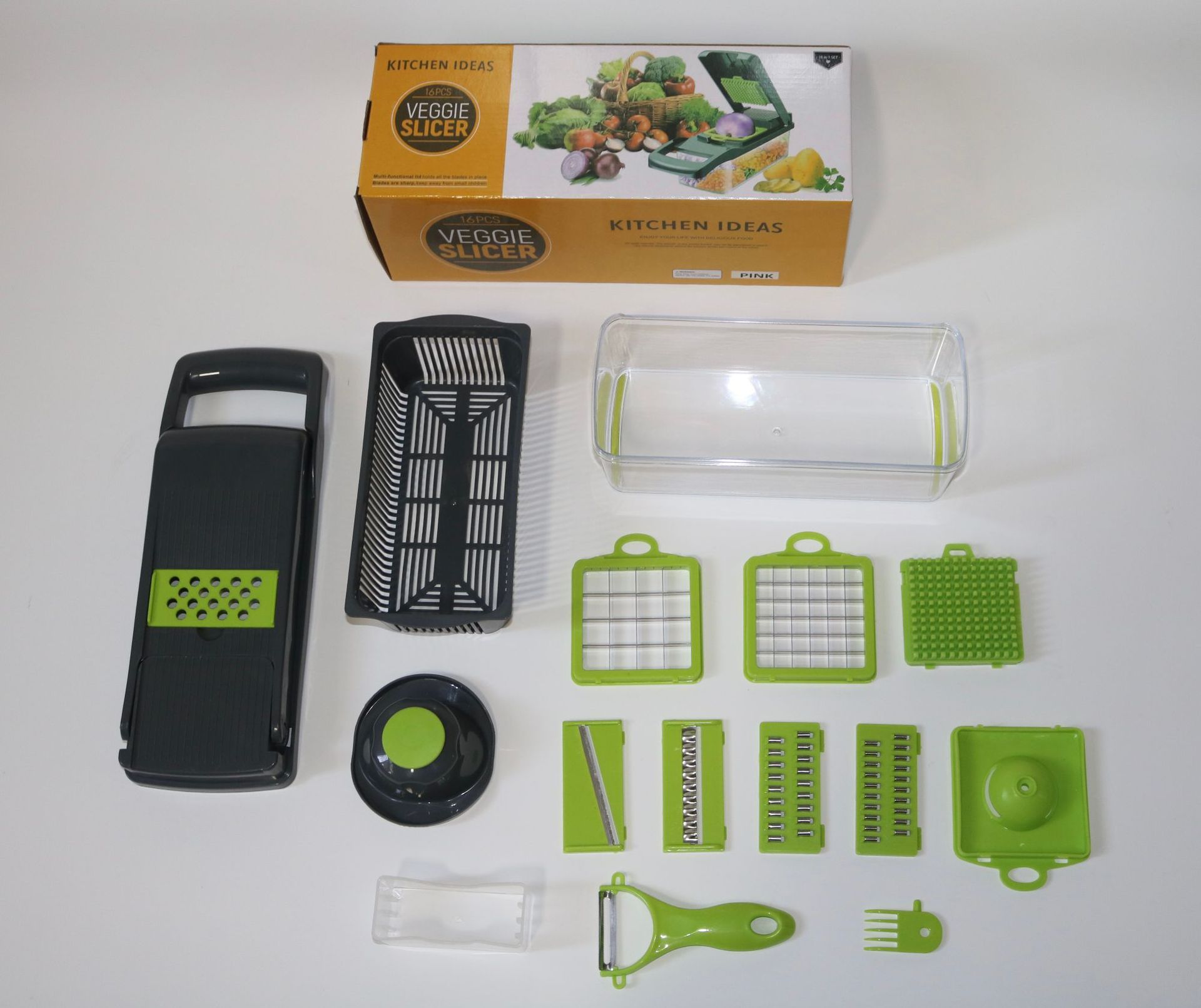 Kitchen vegetable slicer set with packaging on a white background