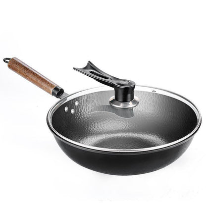 Black frying pan with wooden handle and glass lid on a white background