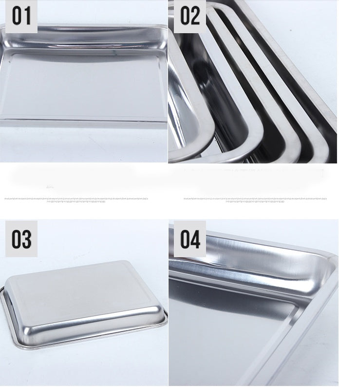 Collection of stainless steel kitchen items including trays and a lid on a white background.