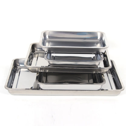 Set of stainless steel trays of different sizes on a white background