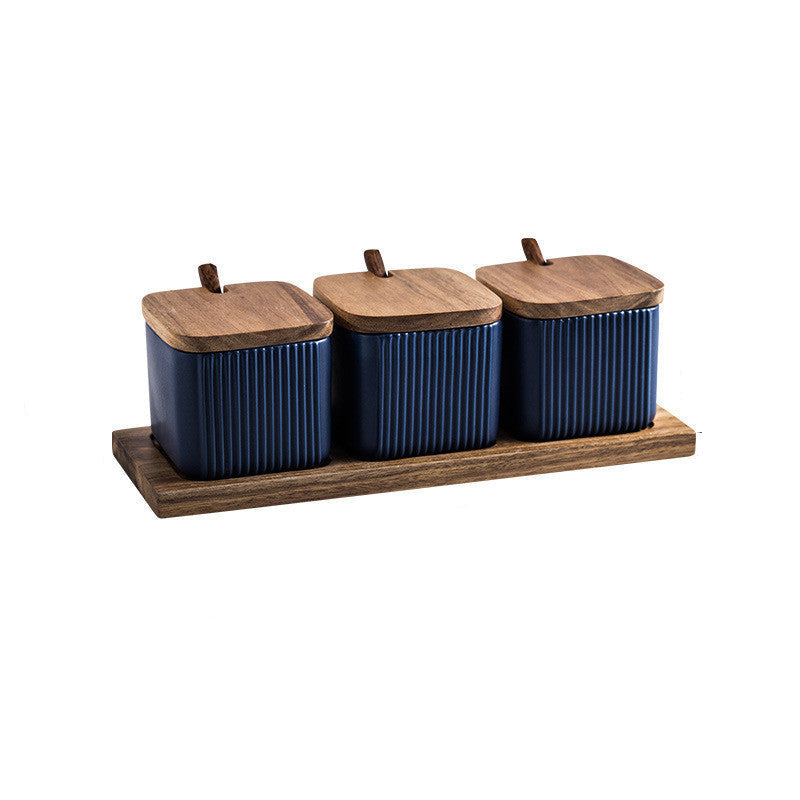 Set of three blue canisters with wooden lids on a wooden tray, with dimensions indicated.