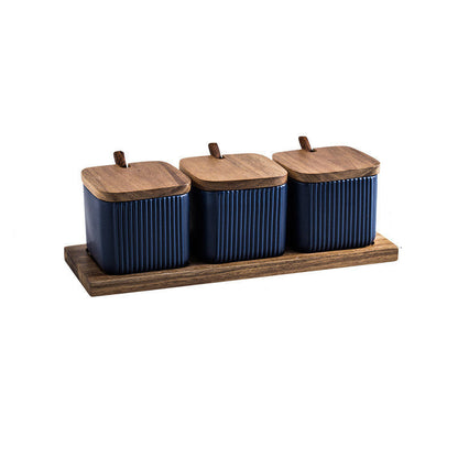 Set of three blue canisters with wooden lids on a wooden tray, with dimensions indicated.