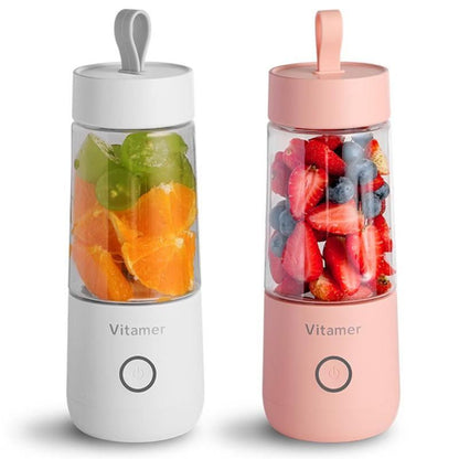 Two portable fruit infusers, one white and one pink, with fruits inside on a white background.
