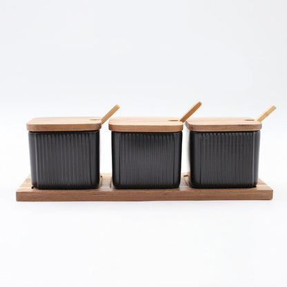 Three black containers with wooden lids on a wooden stand, labeled 'Black' and '30.5X10.7cm'.