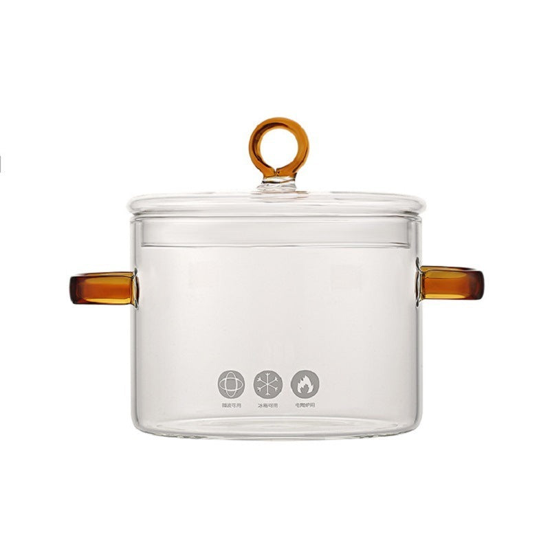 Clear glass pot with amber handles on a white background