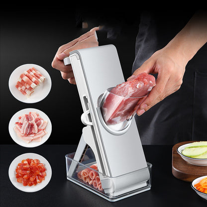 Person using a meat tenderizer with sliced meat on plates and vegetables on the side.